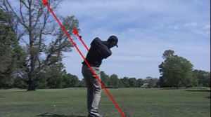 Here the golfer has allowed the club to swing through impact and into his finish as he pivots his body to face the target.